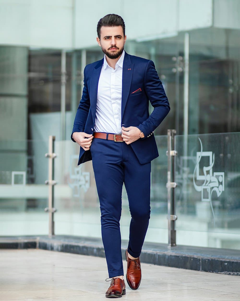 Man in a navy blazer and white shirt